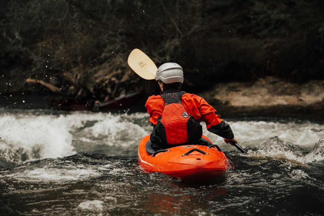Whitewater kayaker navigating river rapids